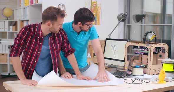 Engineers Discussing Drafts alt