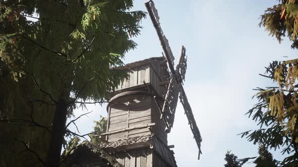 Old Traditional Wooden Windmill in the Forest alt