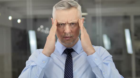 Headache, Portrait of Tense Grey Hair Businessman in Office