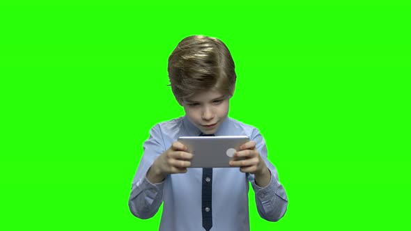 Excited Kid Playing Game on Smartphone