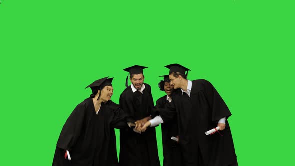 Young Happy People at the Graduation Ceremony Group High Five on a Green Screen Chroma Key