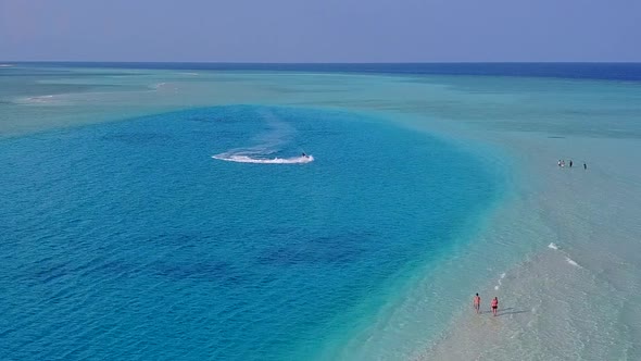 Aerial drone seascape of island beach trip by blue ocean and sand background