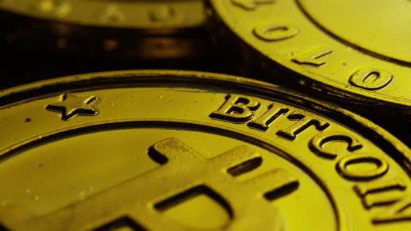 Rotating shot of Bitcoins (digital cryptocurrency) - BITCOIN 0242