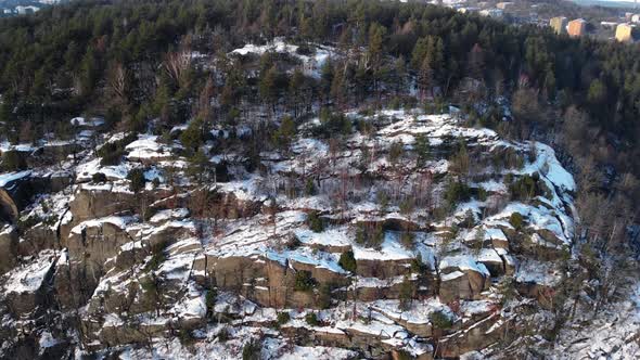 Snow Covered Mountain Rock Wall Aerial Sideway