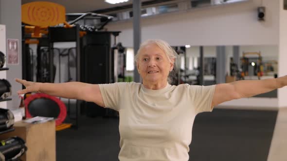 Elderly Woman Performs Exercises Physical Education