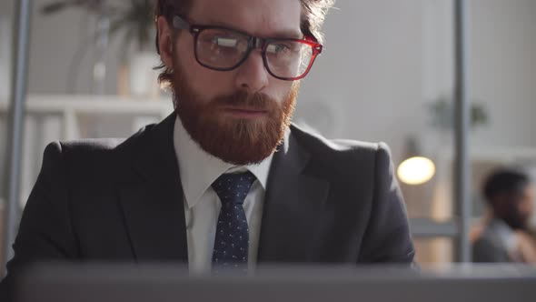 Portrait of Confident Young Businessman at Work in the Office