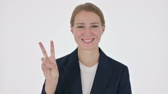 Young Businesswoman Showing Victory Sign on White Background
