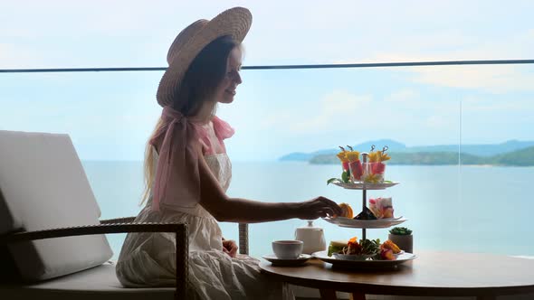 Tea with Selection of Various Desserts in Luxury Restaurant with Sea View