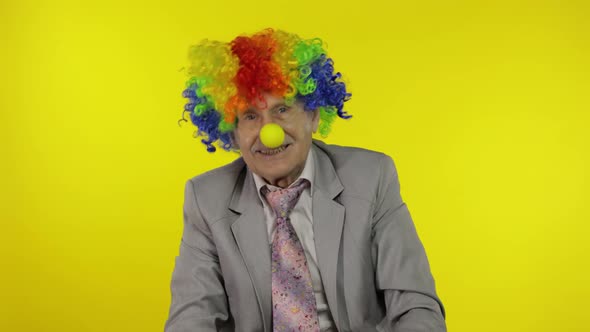 Senior Clown Businessman Entrepreneur Boss Making Silly Faces. Expressions