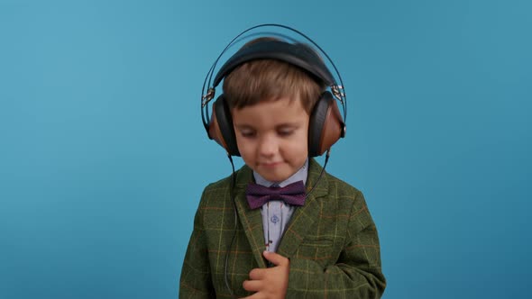 Handsome Little Toddler Boy Listening to Music with Old Headphones Child Having Fun Funny Dancing in