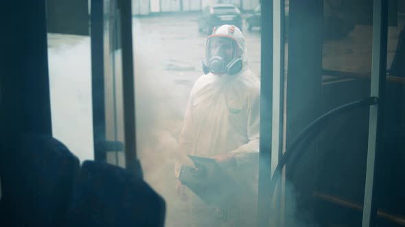 Disinfectant is Getting Sprayed Into the Bus By the Expert