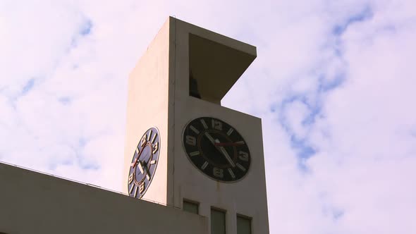 Bell Tower Under Flowing White Clouds alt