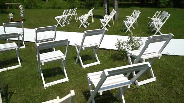 white chairs at the exit ceremony, reception	