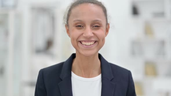 Portrait of Smiling African Businesswoman Looking at Camera