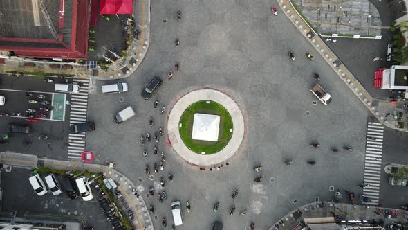 Top aerial view of Tugu Yogyakarta Landmark with busy traffic.