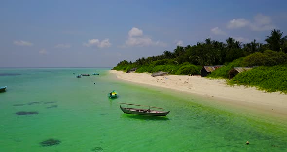 Wide birds eye copy space shot of a summer white paradise sand beach and aqua blue water background 