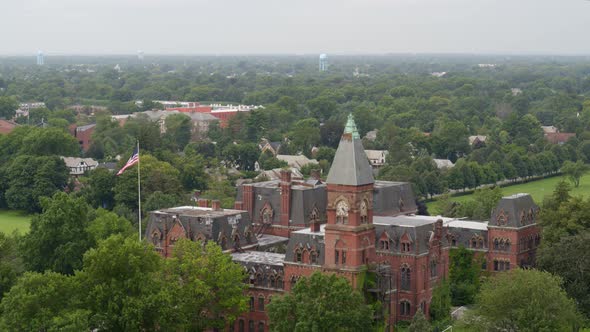 Flying Towards a Gothic Revival Architecture Historic Building in Garden City