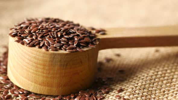 Close Up of Flax Seeds on Wooden Spoon on Table