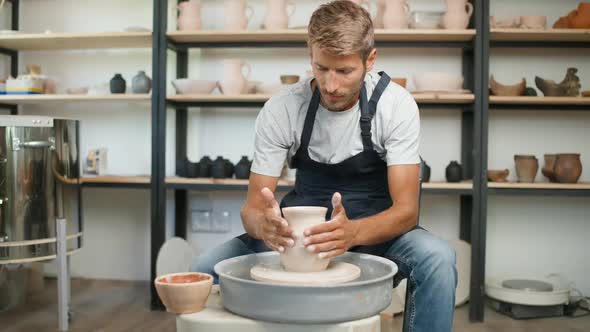 Man Potter Makes a Pitcher Out of Clay Handicraft Production of Handmade Tableware Pottery Workshop