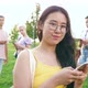 Young happy asiatic woman outdoor using smartphone - VideoHive Item for Sale