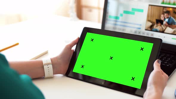 Woman with with Green Screen on Tablet Pc at Home