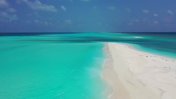 Aerial top down sky of idyllic seashore beach journey by blue lagoon with white sand background of a