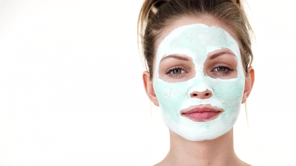 Girl with Green Mud Mask on Face