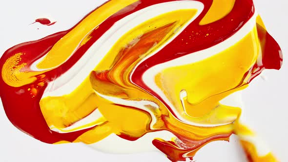 Artist Mixing Ingredients Red and Yellow Watercolor Using Palette Knife and Pigments on White