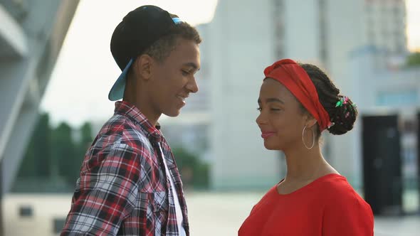 Teen Boyfriend Giving Flowers to Girl, Congratulating on Birthday, Romantic Date