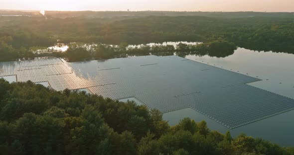 Group of Photovoltaic Panels Floating on Open Water in Pond