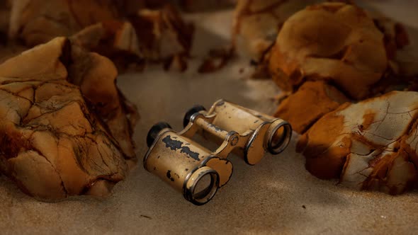 Old German Military Binoculars on the Sand Beach alt