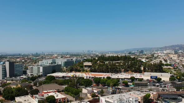 Los Angeles with retail commercial outlet and skyscrapers of Downton LA in background. Ariel view.