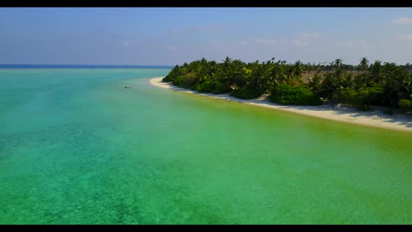 Aerial drone travel of relaxing shore beach time by aqua blue water and white sandy background of a 