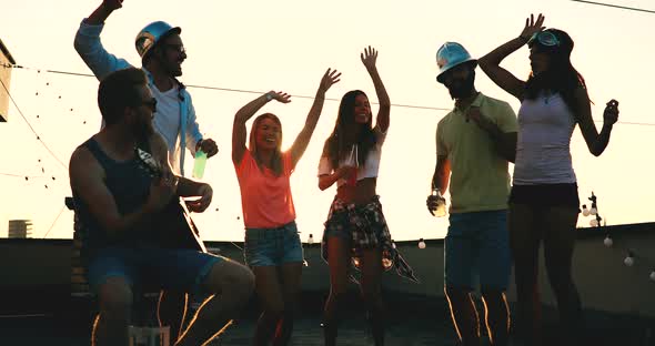 Group of Happy Friends Having Party on Rooftop