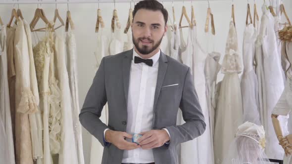 Groom Giving the Wedding Diamond Ring Towards Camera