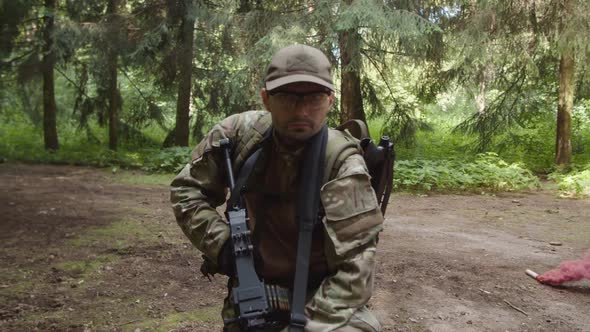 Closeup of Soldier Raising Head Looking Out Evacuation Helicopter