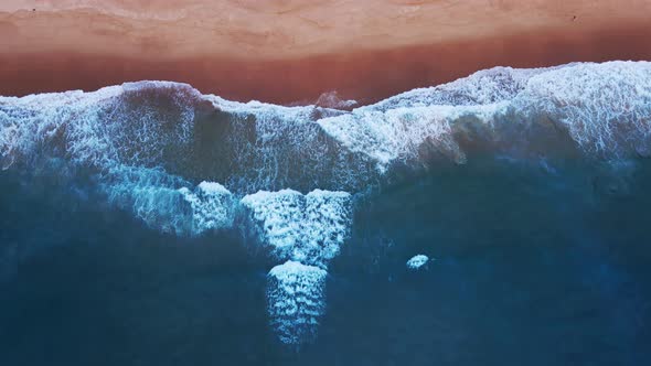 Sea wave on Beach sand in sunset. Aerial view shot on drone camera hight quality (4k3840x2160p29.97f