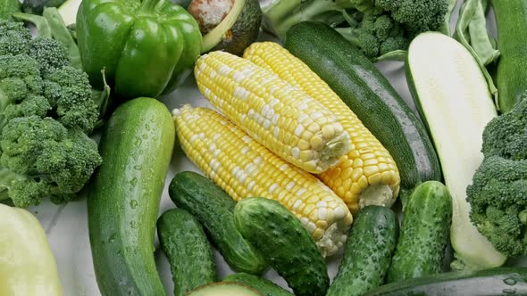 A Tabletop Arrangement of a Variety of Fresh Fruits and Vegetables Sorted By Colors Pepper Corn