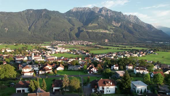 Aerial View of Liechtenstein with Houses on Green Fields in Alps Mountain Valley