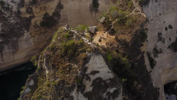 Aerial Drone Flight Over Treehouses at Atuh Cliff at Nusa Penida Island Bali Indonesia