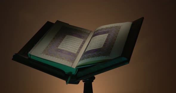 Holy Quran On Book Rest With Prayer Beads