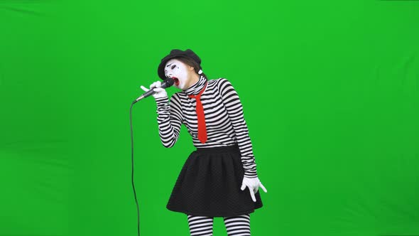 Mime Girl Singing a Song in Microphone, Dancing. Chroma Key