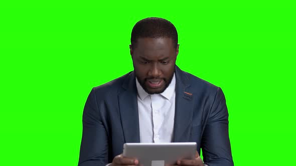 Funny Afro American Businessman Playing on Pc Tablet.