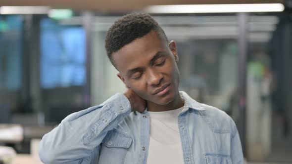 Portrait of African Man having Neck Pain