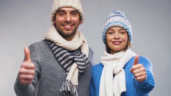 Happy Couple in Winter Clothes Showing Thumbs Up 8