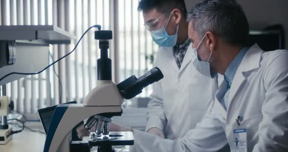 Scientist Looking at Camera in Laboratory