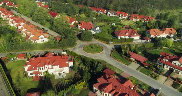 Aerial view of a new housing estate in the suburbs, camera moving left.