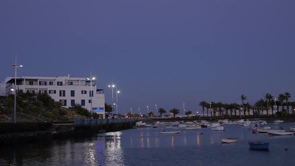 modern harbor with boats at dusk- Arrecife Harbour