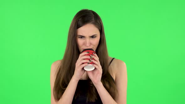 Girl Drinks Unpalatable Coffee and Is Disgusted on Green Screen