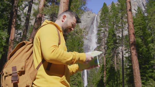 White Male Hiking on Trail Up Peaceful High Elevation with Yosemite Waterfall